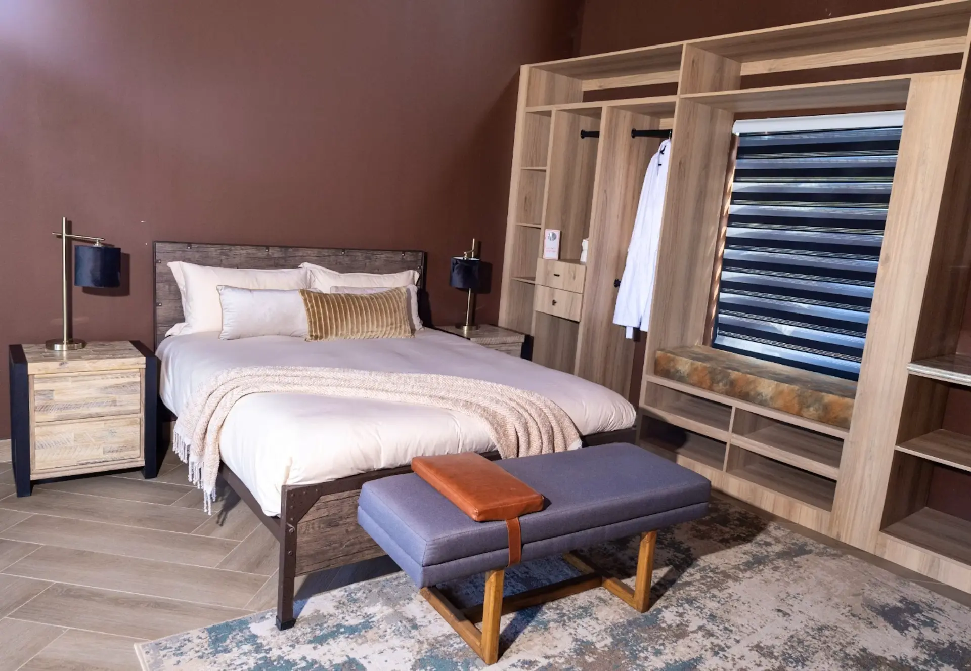 Villa bedroom with reclaimed timber headboard and brass lamps